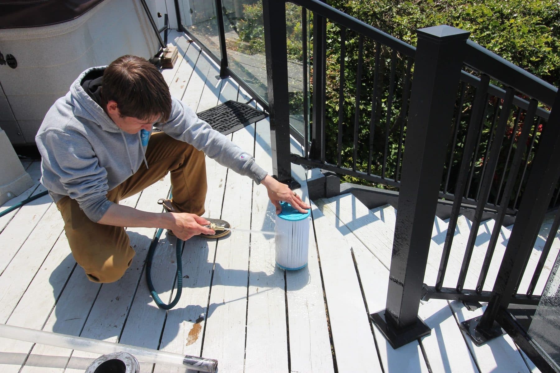 Technician servicing a hot tub filter